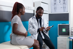 a gynecologist discussing the payment plan with a patient